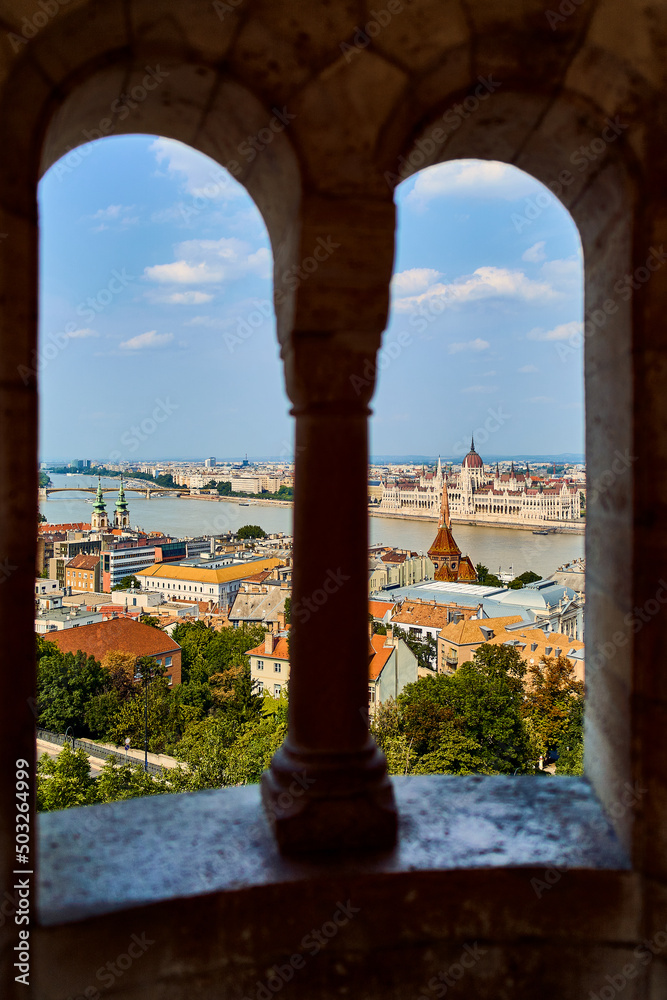 Coast with parliament in budapest, view through the window of a fishing bastion