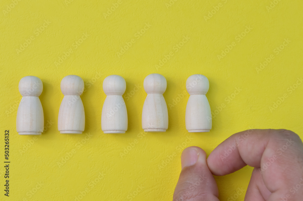 Man finger kicking an office worker. Unsuccessful employee, job reduction, failure and trouble concept. Man finger kicking an office worker. Unsuccessful employee, job reduction, failure and trouble concept.