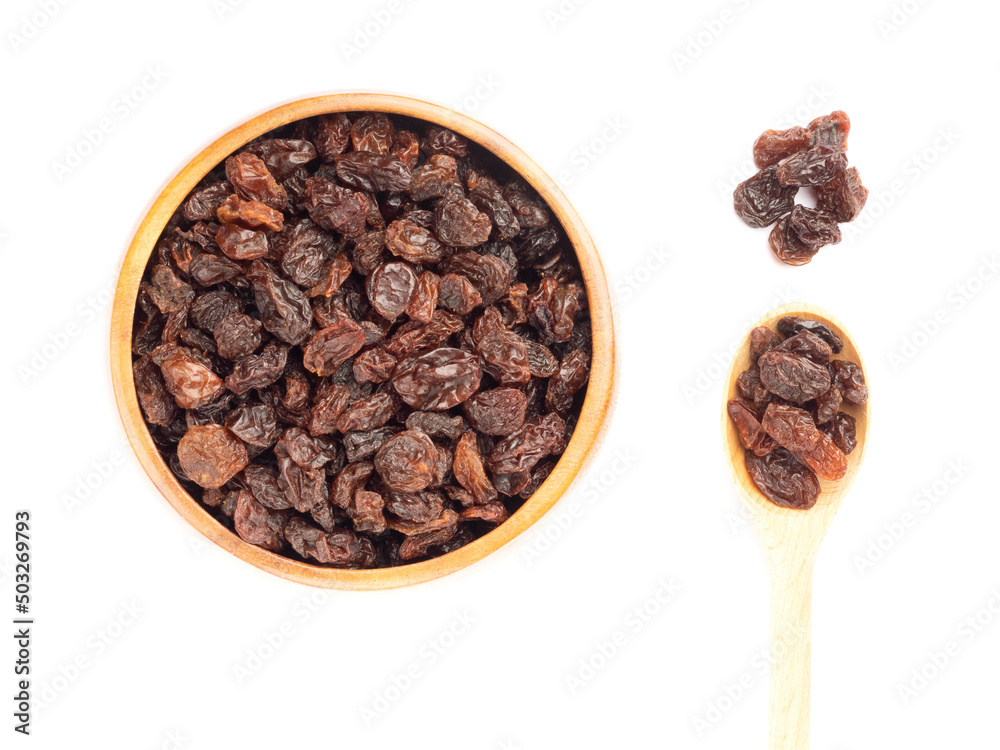 Raisin in brown wooden bowl, spoon, bunch, isolated on white background Raisin in brown wooden bowl, spoon, bunch, isolated on white background