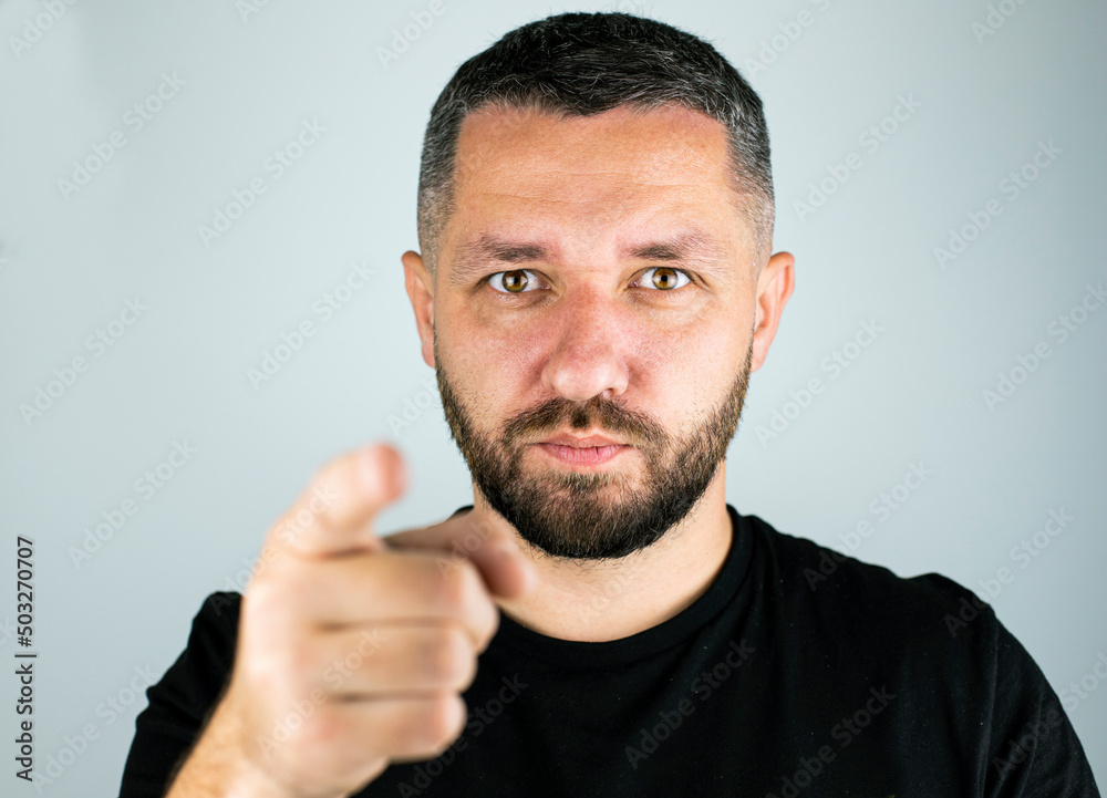 man with a happy face points a finger man with a happy face points a finger
