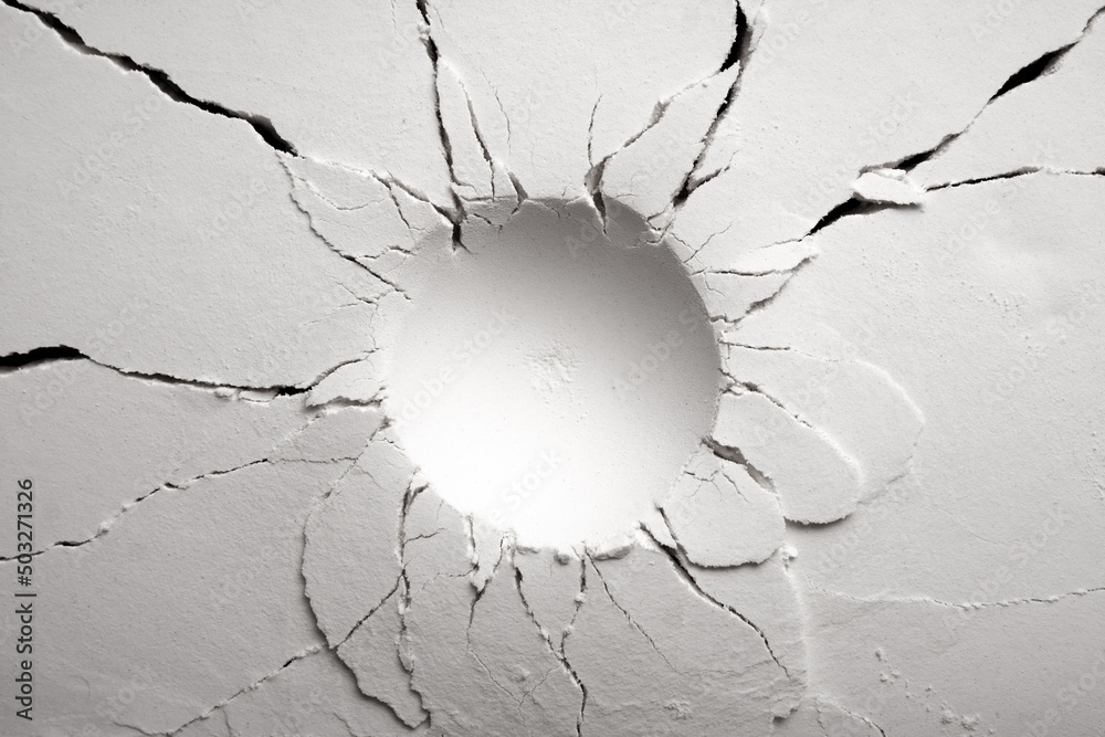 White powder surface with cracks and a round crater. Crater in black and white. - obrazy, fototapety, plakaty 