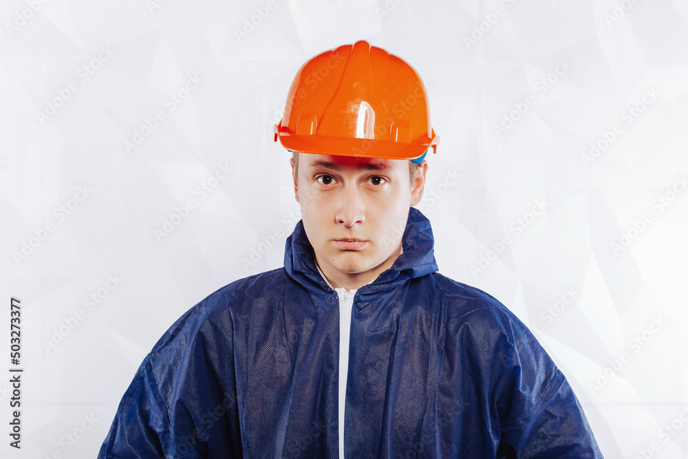 Male civil engineer. Architect with drawings on a construction site. Portrait of an adult guy builder, engineer, architect Male civil engineer. Architect with drawings on a construction site. Portrait of an adult guy builder, engineer, architect