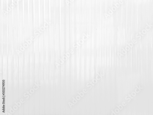 white metal sheet wall with corrugated pattern texture use as background. bright white metallic or zinc wall background for industrial concept.