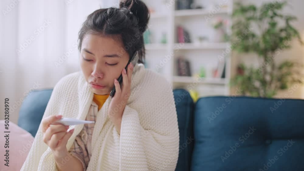 Ill woman with high fever calling for doctor consultation, sick with coronavirus Ill woman with high fever calling for doctor consultation, sick with coronavirus