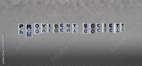 provident society word or concept represented by black and white letter cubes on a grey horizon background stretching to infinity