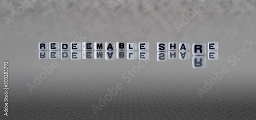 redeemable share word or concept represented by black and white letter cubes on a grey horizon background stretching to infinity