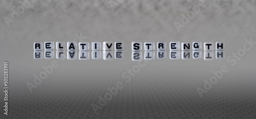 relative strength word or concept represented by black and white letter cubes on a grey horizon background stretching to infinity