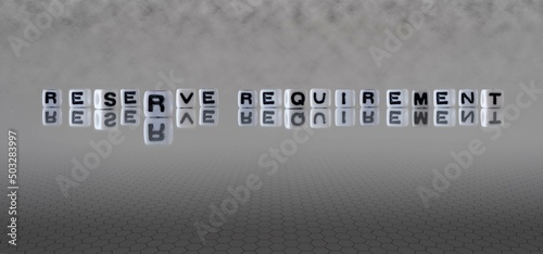 reserve requirement word or concept represented by black and white letter cubes on a grey horizon background stretching to infinity
