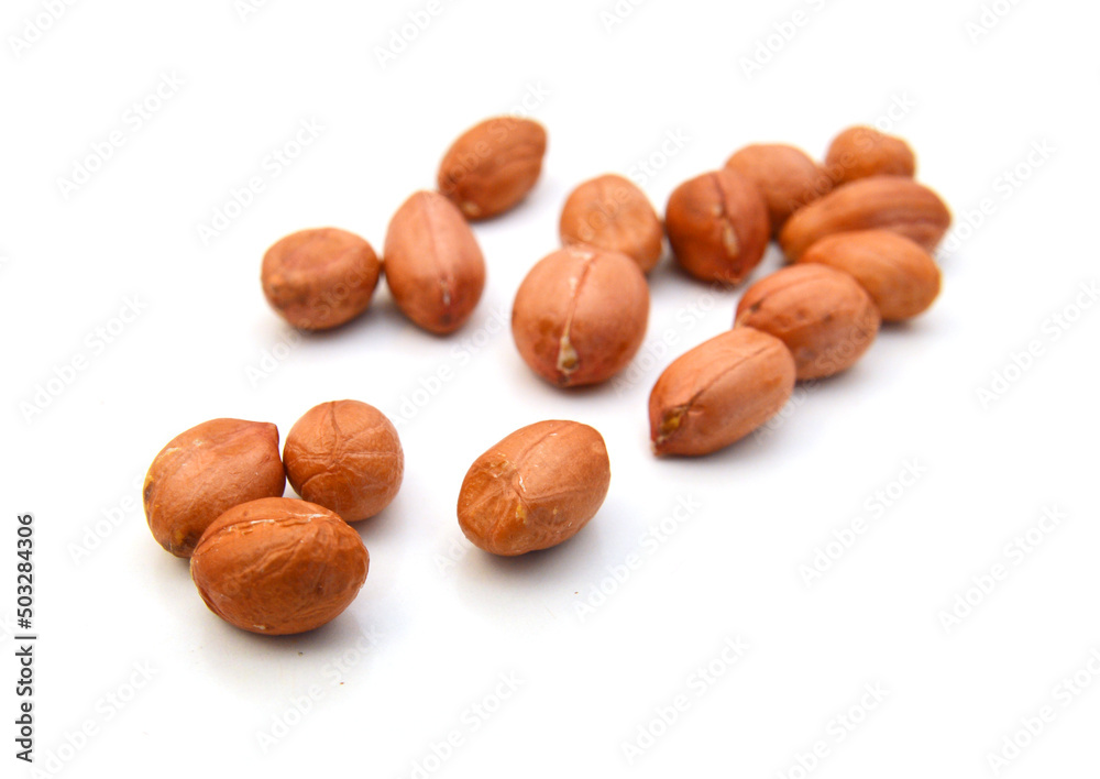 Composition from nuts in glass bowl on the white isolated background Composition from nuts in glass bowl on the white isolated background