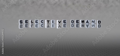 selective demand word or concept represented by black and white letter cubes on a grey horizon background stretching to infinity