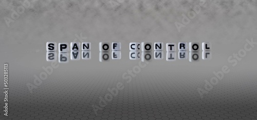Photography span of control word or concept represented by black and white letter cubes on a