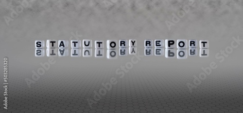 statutory report word or concept represented by black and white letter cubes on a grey horizon background stretching to infinity