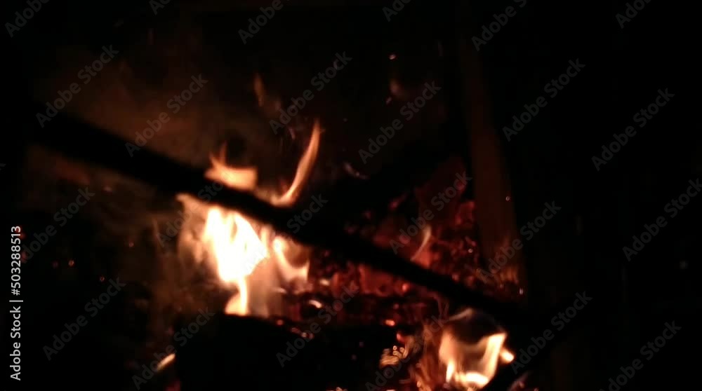 Brick fireplace with fire and firewood Brick fireplace with fire and firewood
