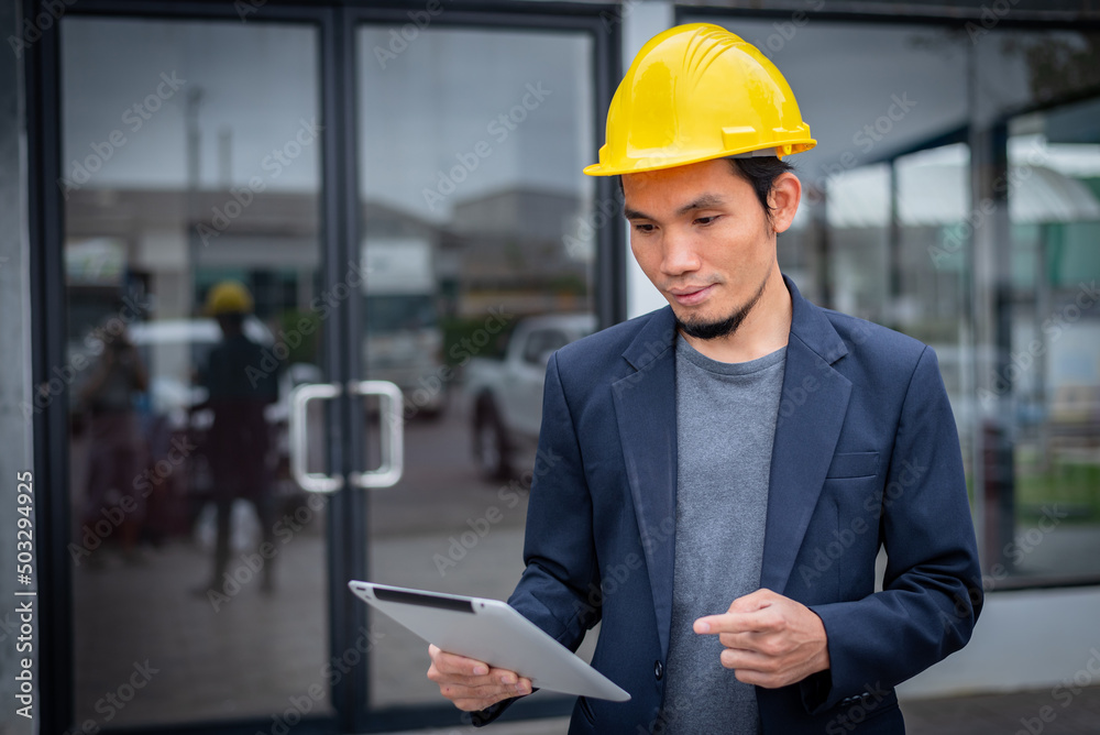 Architects or engineers holding digital tablets, working man using digital tablet at construction office. Architects or engineers holding digital tablets, working man using digital tablet at construction office.