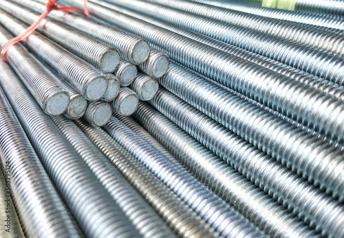 Fotobehang Selective focus of many long screw threaded rods in construction and industrial