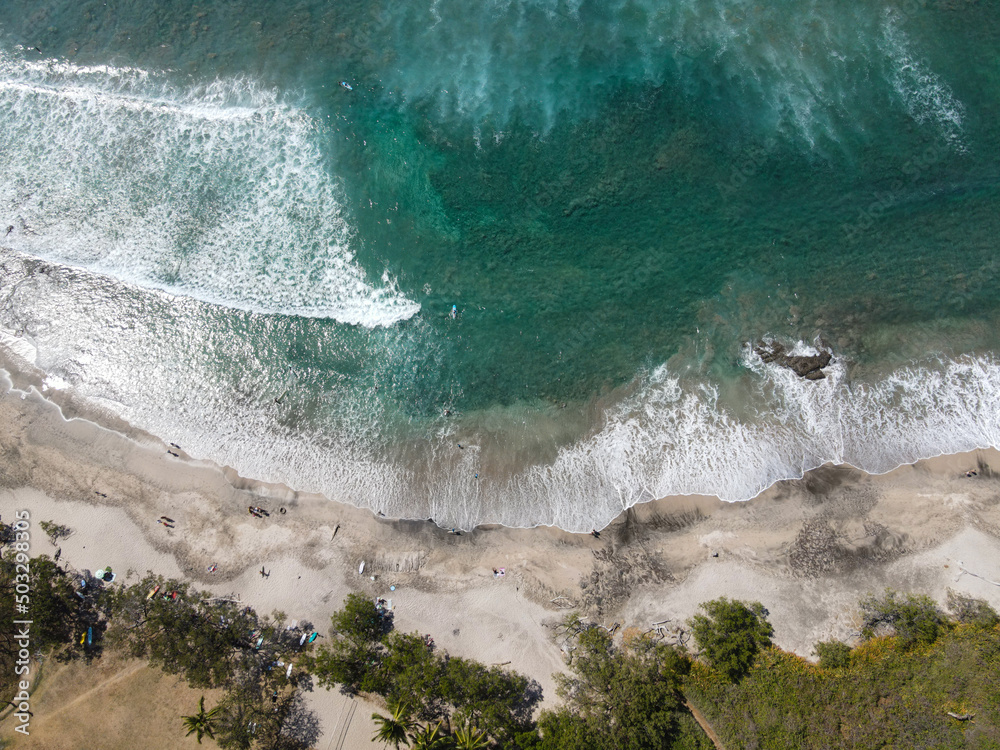 Aerial, surfing at the beach of Playa Negra, Costa Rica.