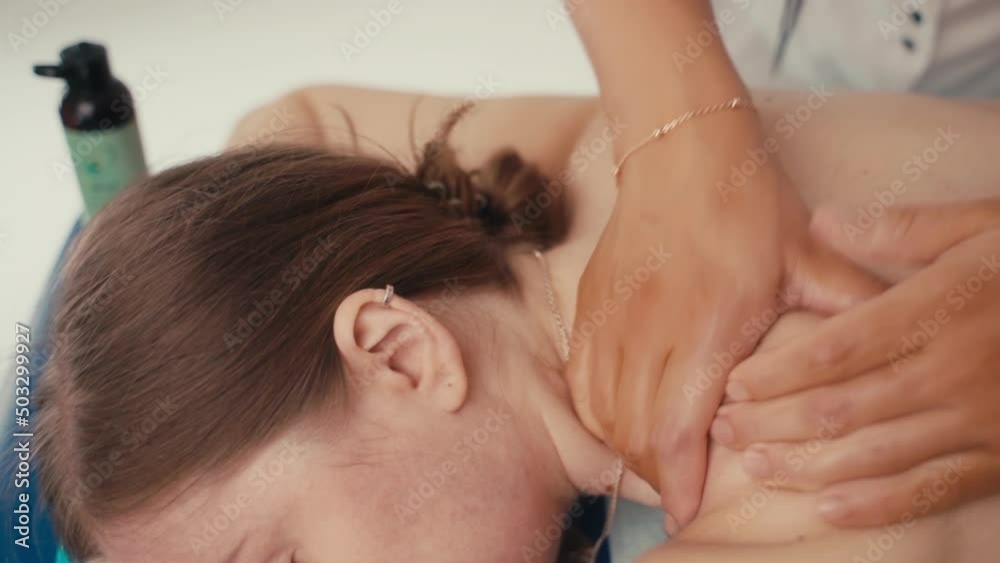 Relaxed woman getting back massage in luxury spa with professional massage therapist. Wellness, healing and relaxation concept. Relaxed woman getting back massage in luxury spa with professional massage therapist. Wellness, healing and relaxation concept.