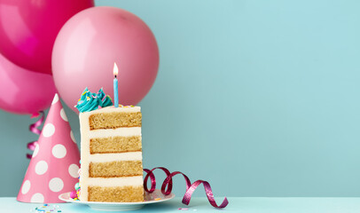 Slice of birthday cake with birthday candle and balloons