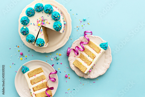 Birthday party background with birthday cake and birthday cake slices photo