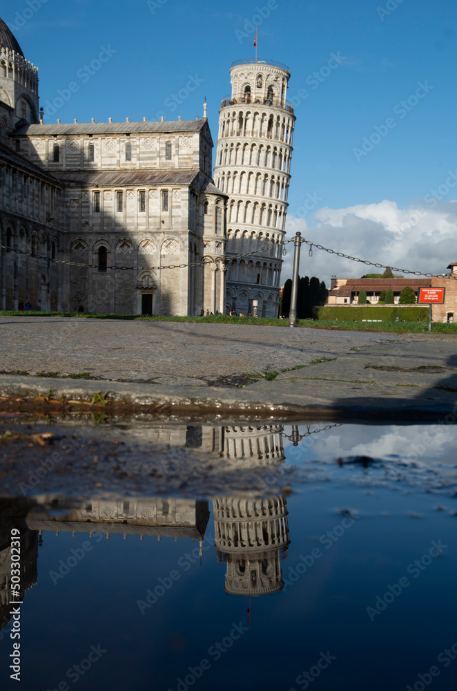 Leaning Tower's reflection in a puddle.