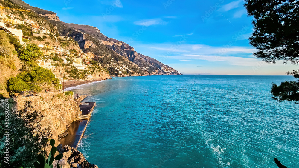 Panoramic view of the sandy Marina Grande Beach and colorful buildings of village Positano at Amalfi Coast, Italy, Campania, Europe. Luxury vacation stay at the Tyrrhenian and Mediterranean Sea