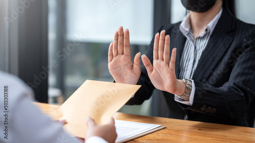 Lawyer refuses to accept bribe from business people in contracting. Corruption and anti bribery concept.