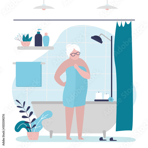 Elderly woman finished morning or evening spa treatments. Grandmother wrapped in towel after relaxing bath. Daily hygiene procedures. Design bathroom interior. Skin and body care.