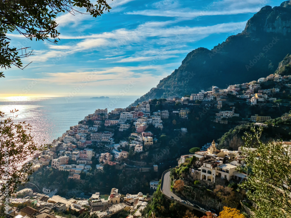 Aerial panoramic view on colorful houses of coastal town Positano, Amalfi Coast, Italy, Campania, Europe. Road trip at dawn. Vacation at coastline at Tyrrhenian, Mediterranean Sea. Awe path of gods