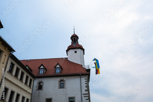 Town hall of Schmöllin in Thuringia, with flag of Ukraine