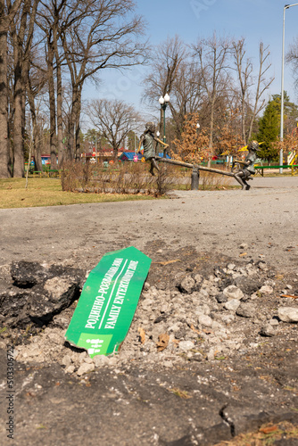 broken high signpost in park on Ukraine war background photo