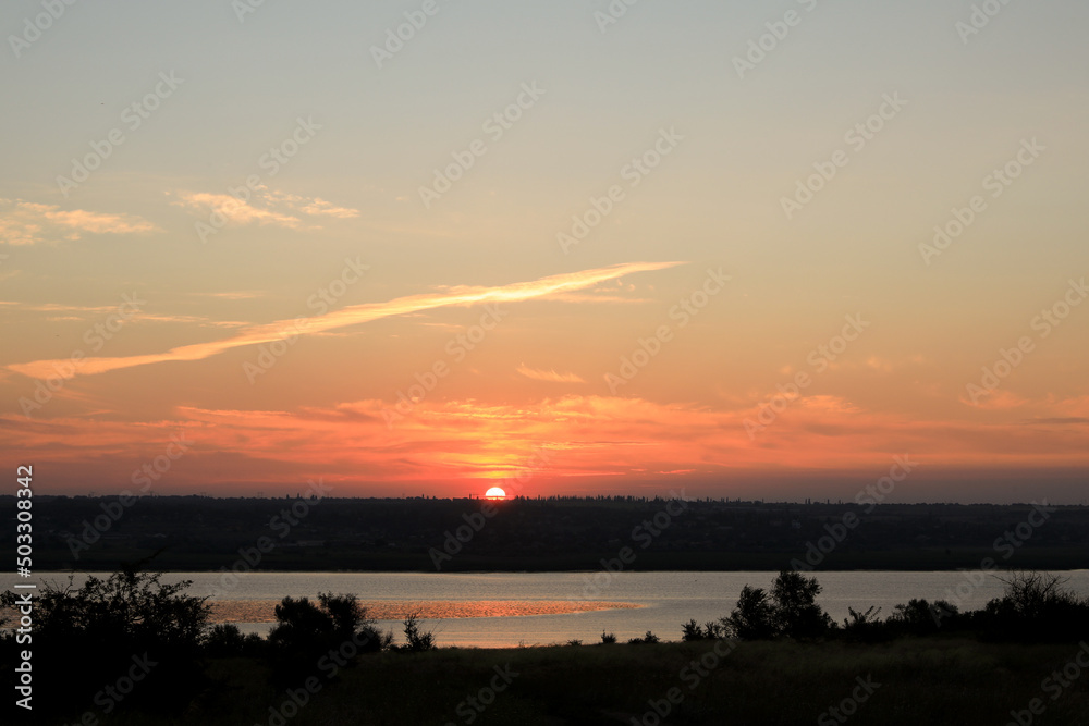 Picturesque view of beautiful sky over river at sunrise