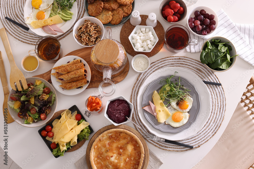 Many different dishes served on buffet table for brunch, flat lay Many different dishes served on buffet table for brunch, flat lay