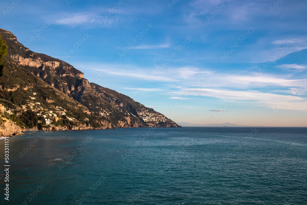 Panoramic view from Fornillo Beach on the coastal towns Positano and Praiano at the Amalfi Coast, Italy, Campania, Europe. Vacation at the mountainous  and hilly coastline of the Mediterranean Sea