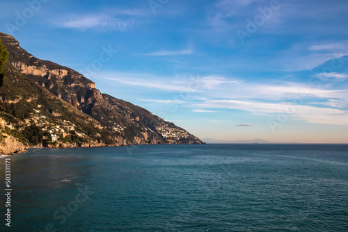 Panoramic view from Fornillo Beach on the coastal towns Positano and Praiano at the Amalfi Coast, Italy, Campania, Europe. Vacation at the mountainous and hilly coastline of the Mediterranean Sea