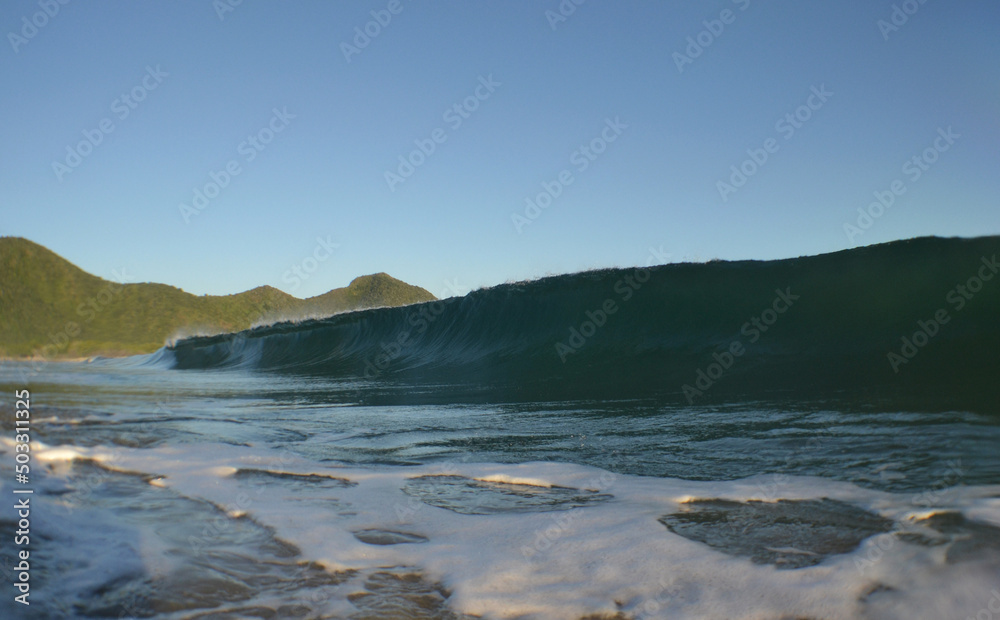 
waves on a beach in the Caribbean Sea, paradise of surfing