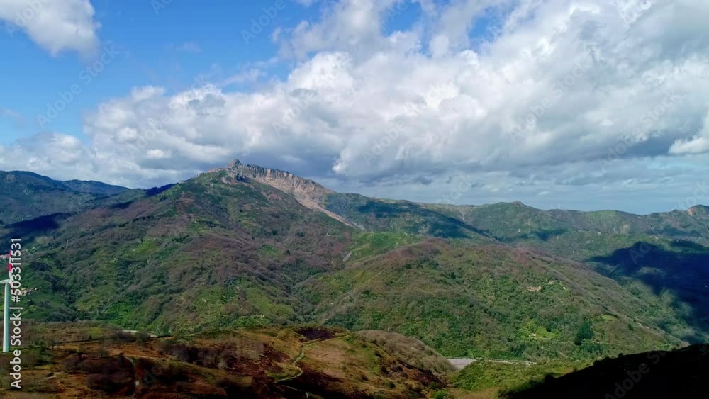 Wind Turbine In The Sicilian Mountains At Daytime In Italy. - aerial Wind Turbine In The Sicilian Mountains At Daytime In Italy. - aerial