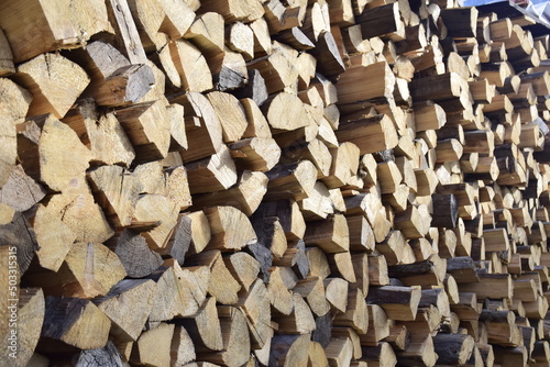 firewood stacked near the wall close-up