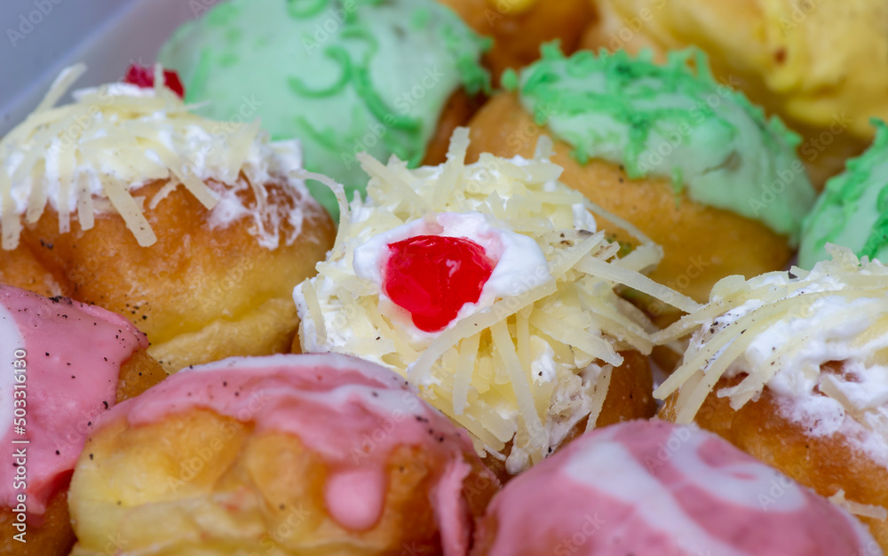 Close up of colorful mini donut, in shallow focus