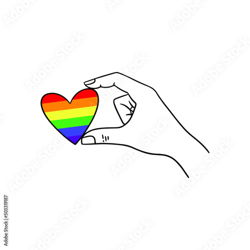 Arm holding the heart coloured in LGBT pride colours on the white background. Concept of the International Day Against Homophobia concept, sexual equality, feminism, social safety.