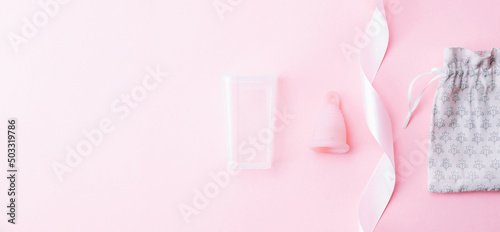 Menstrual cramp, use menstrual cup inside vagina. Pink ribbon with menstrual cup. Menstruation feminine period. Medical healthcare gynecological banner.
