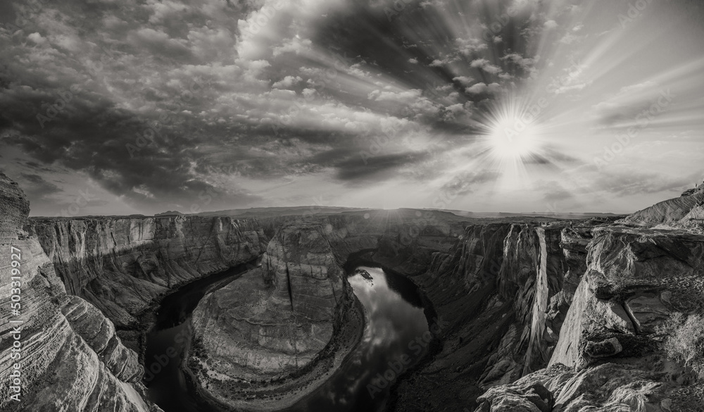 Fototapeta premium Horseshoe Bend panoramic aerial view, Arizona. Rocks and Colorado River at sunset in black and white.