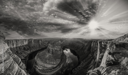 Horseshoe Bend panoramic aerial view, Arizona. Rocks and Colorado River at sunset in black and white.