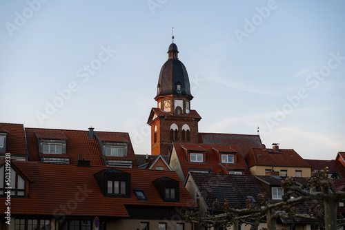 Big church in the skyline of Waren (Müritz) in Germany. Old buildings in the city with red tiled roofs. Traditional architecture in the evening. Travel destination in Mecklenburg-Vorpommern.