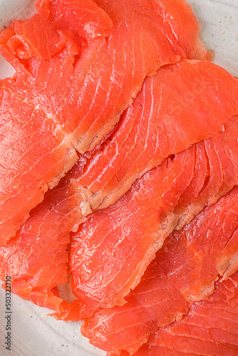 smoked red fish slices on a plate