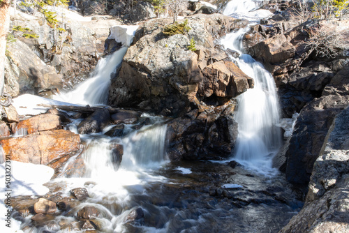 A waterfall spills down a mountain near Nederland Colorado