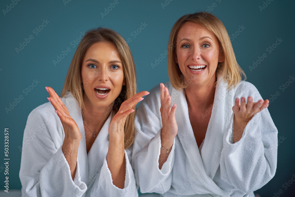 Two girl friends or couple in bedroom having fun Two girl friends or couple in bedroom having fun