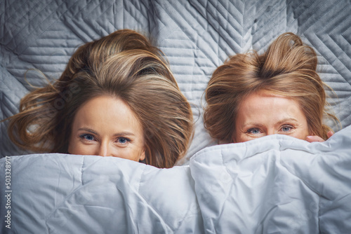 Picture of two girls friends or couple in the bed