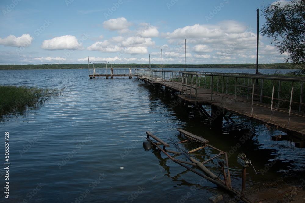 an old metal pier with railings on the Volga river. Ulyanovsk
