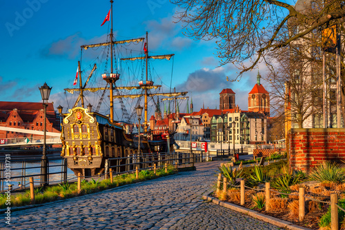 Beautiful architecture of Gdansk old town reflected in the Motlawa river at sunrise, Poland