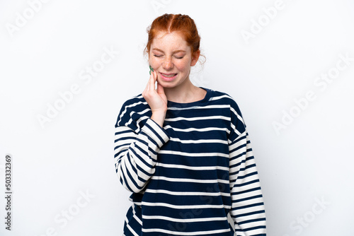 Young reddish woman isolated on white background with toothache